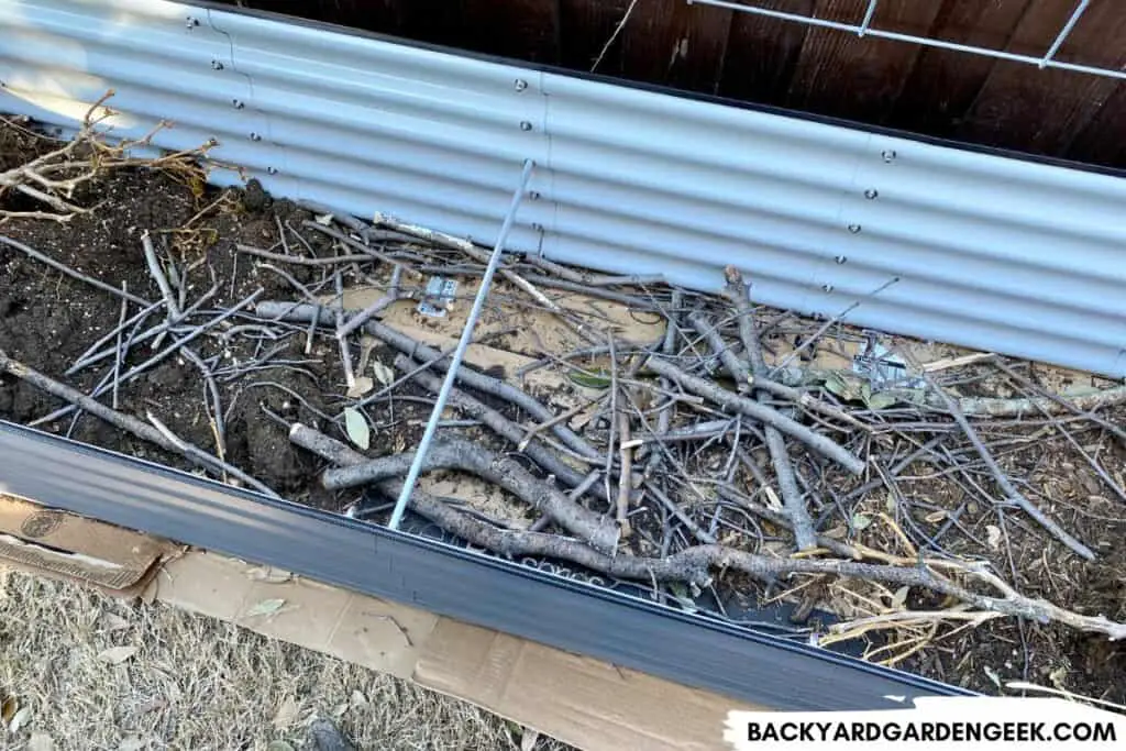 Branches and Sticks in Raised Garden Bed