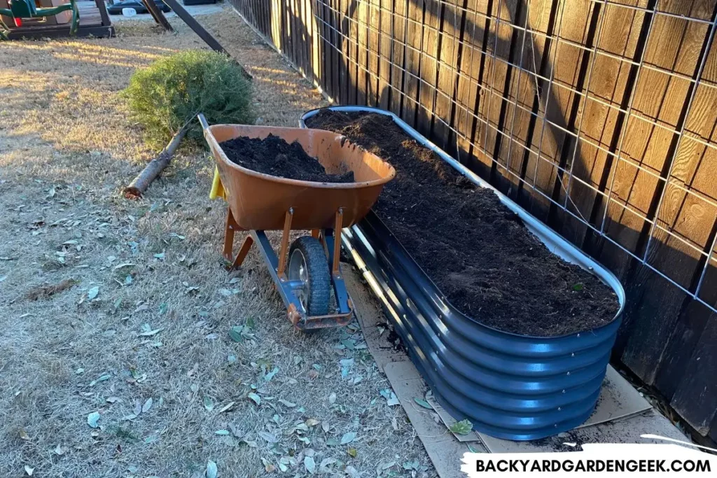 Wheelbarrow Next to a Metal Raised Bed