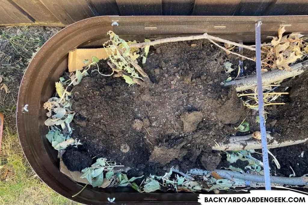 Bark, Mulch, and Wood in Bottom of Raised Garden Bed