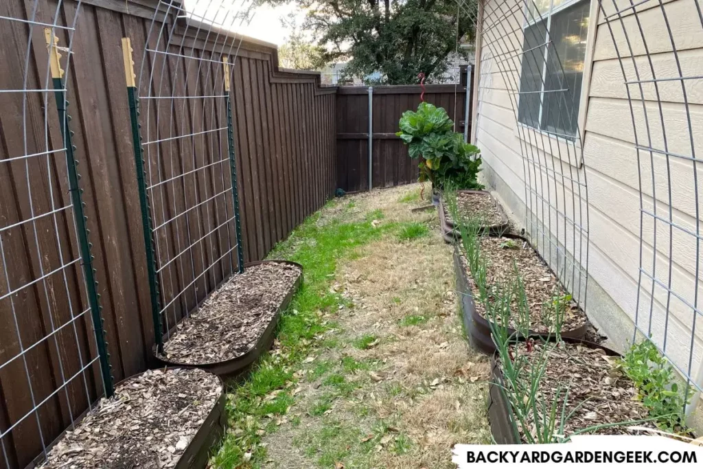 Raised Garden Beds on a Slope Behind Garage