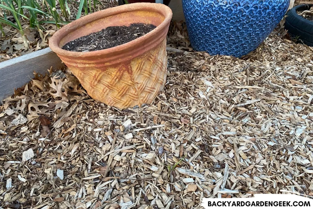 Wood Mulch Piled Up Around Garden Containers