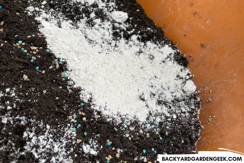 Close Up of Diatomaceous Earth, Fertilizer, and Soil