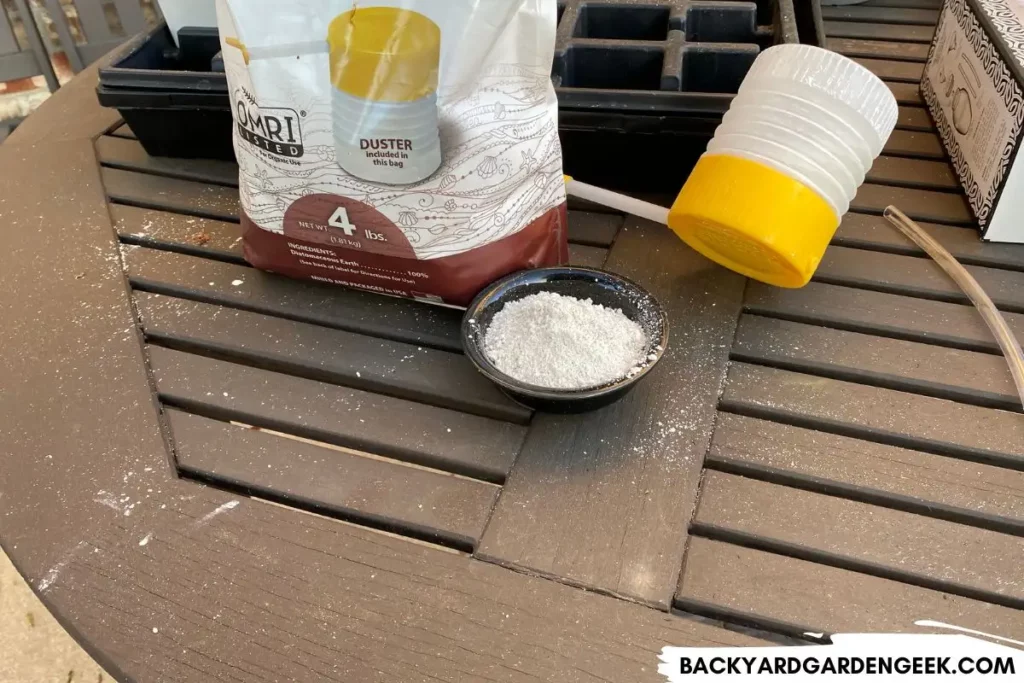 Bag of Diatomaceous Earth and Duster