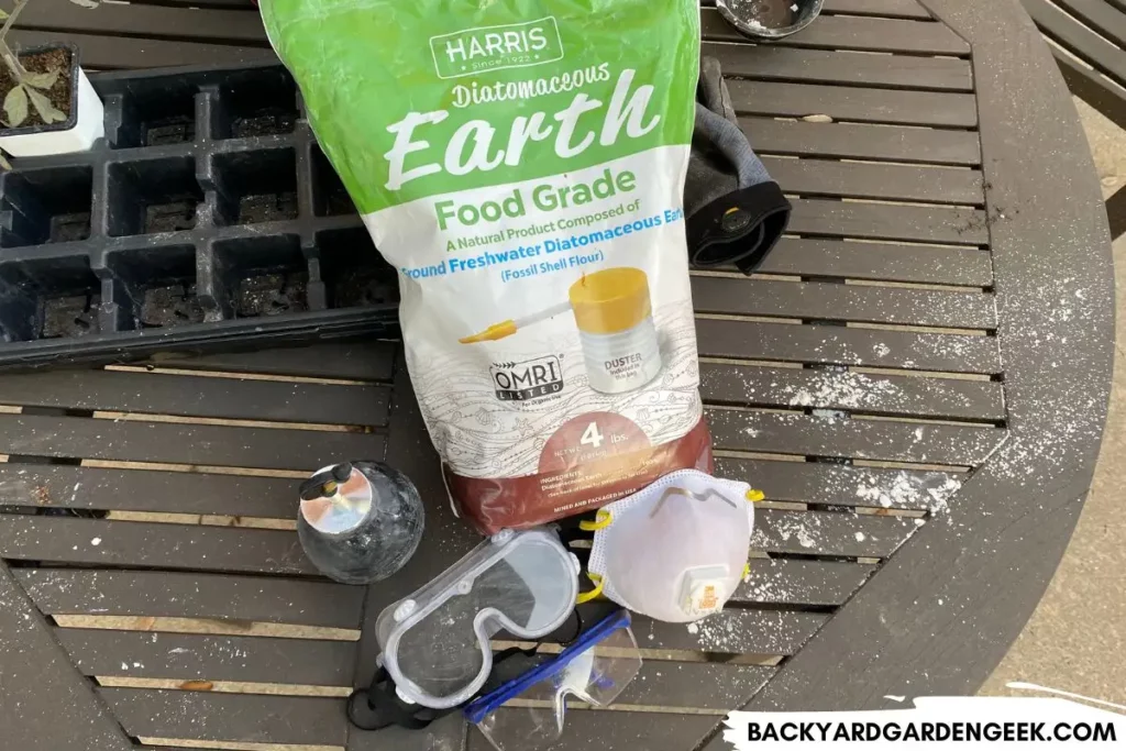 Bag of Diatomaceous Earth and Protective Gear