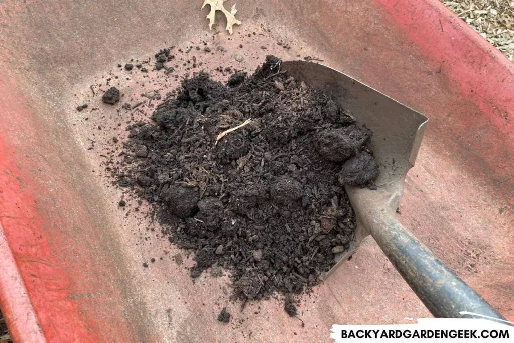 Shoveling Compost Into Wheelbarrow
